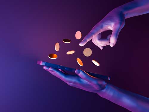 Finger pointing at cryptocurrency coins